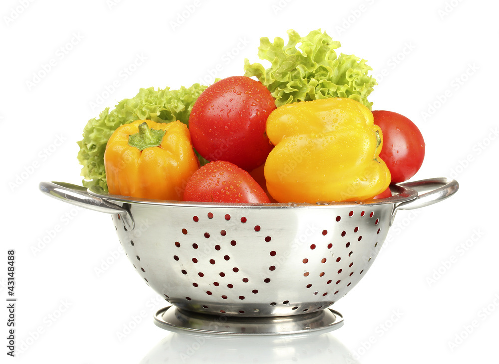 fresh vegetables in silver colander isolated on white