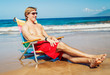 © EpicStockMedia - Young Man Relaxing at the Beach