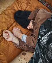 Homeless Man Sleeping In The Street