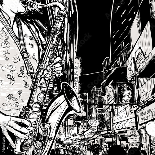 Naklejka ścienna saxophonist playing saxophone in a street