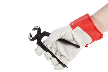 Hand with protection glove holding pincer