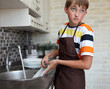 © Denizo - boy doing the dishes