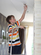 © Denizo - Boy does homework replaces a light bulb
