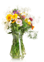 beautiful bouquet of bright  wildflowers in glass vase,