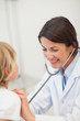 © WavebreakmediaMicro - Smiling doctor auscultating a child
