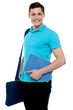 Smiling guy holding notepad and laptop bag