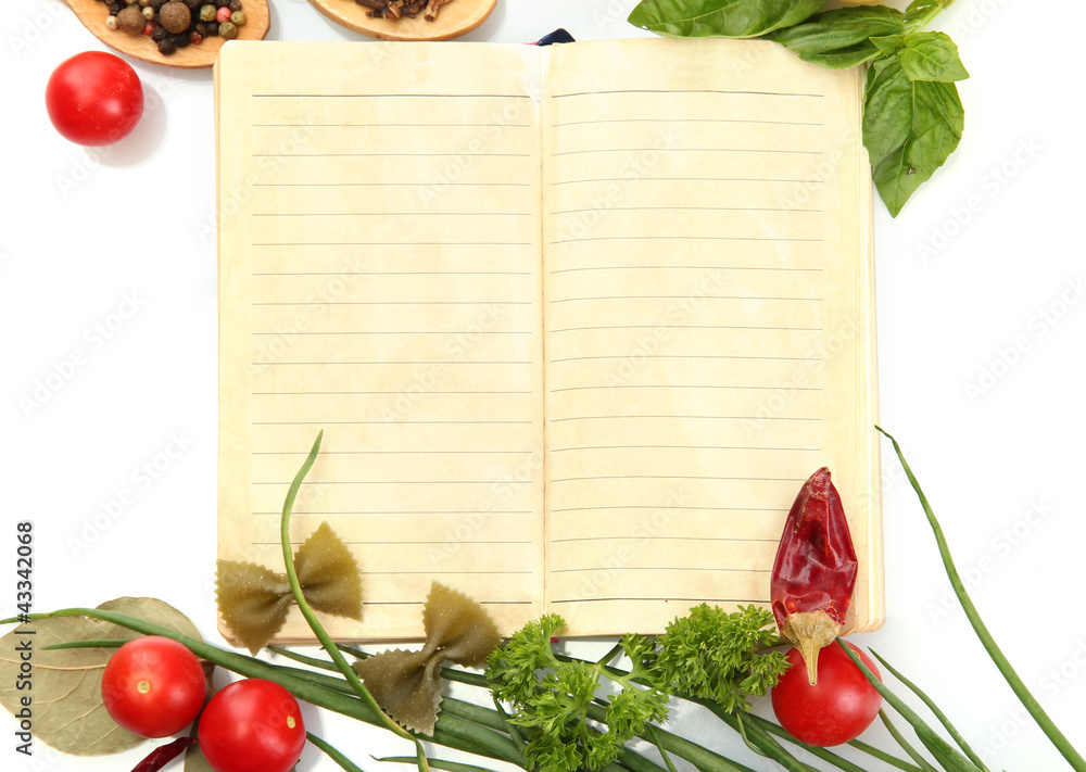 book for recipes, vegetables and spices, isolated on white