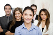 © Andres Rodriguez/Blend Images - Hispanic business people standing together in office