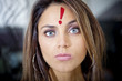 © Andres Rodriguez/Blend Images - Hispanic woman with exclamation mark on her forehead