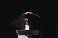 Mixed Race Conductor Pointing Baton