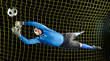© Pete Saloutos/Blend Images - Caucasian soccer goalie jumping in mid-air catching ball at night