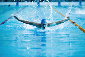 man swims the butterfly