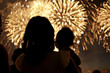 © Granger Wootz/Blend Images - Silhouette of mother and daughter watching fireworks