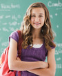 © Mike Kemp/Blend Images - Caucasian teenager standing in classroom