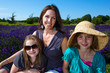 A pretty Mom with her beautiful children in lavender field