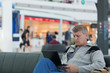 © Shchipkova Elena - male traveler with the laptop uses a Wi-Fi