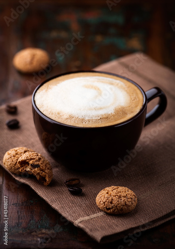 Fotografie, Obraz Cup of cafe au lait and biscotti on the table