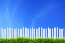 White Fence And Blue Sky