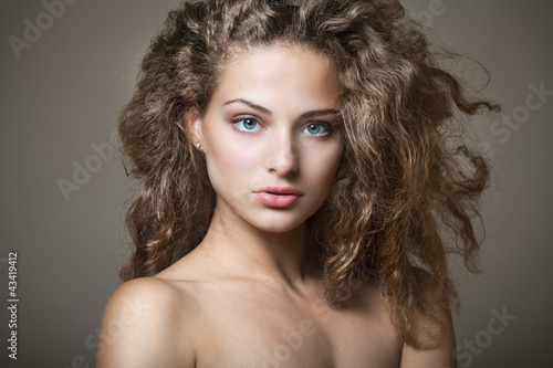 Fotografie, Obraz Beautiful young woman with gorgeous curly hair