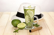 Mojito and a hat on a white wooden background