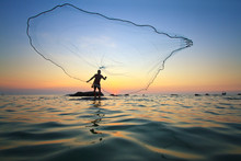 Throwing Fishing Net During Sunrise