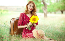 Redhead Girl With Sunflower At Outdoor.