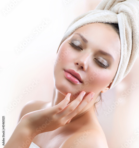 Fototapeta na wymiar Spa Girl. Beautiful Young Woman After Bath Touching Her Face