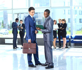 Wall Mural - Two businessmen discussing - Isolated studio