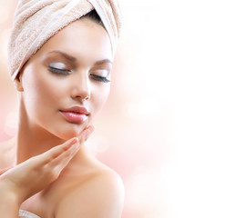 Wall Mural - spa girl. beautiful young woman after bath touching her face