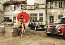 A Vintage Fashion Shoot With A Young Woman Holding An Umbrella