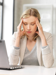 Canvas Print - tired woman with laptop computer