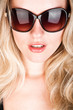 © listercz - studio closeup portrait of a young beautiful woman in sunglasses