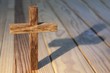 cross on wood table background
