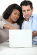 © auremar - A couple looking at their laptop
