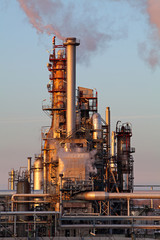 Wall Mural - Smoke from the pipes on oil and gas refinery