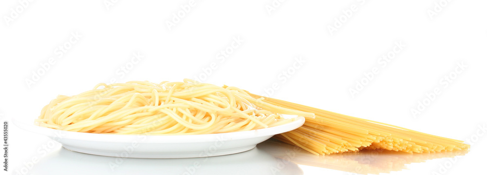 Italian spagetti cooked in a white plate with fork isolated