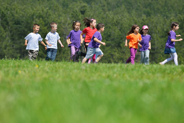 Wall Mural - happy kids group  have fun in nature