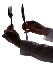 Silhouette Of Woman's Hands With Fork And Knife Isolated