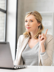 Canvas Print - woman with laptop and finger up