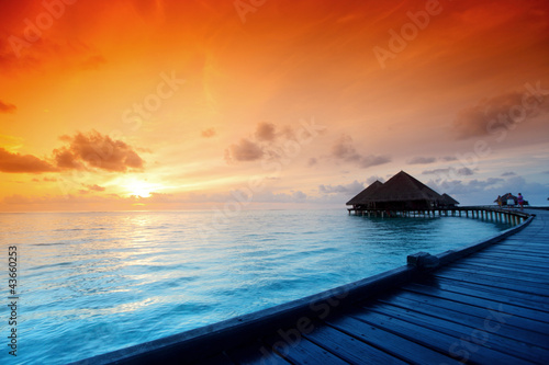 Fototapeta na wymiar maldivian houses on sunrise