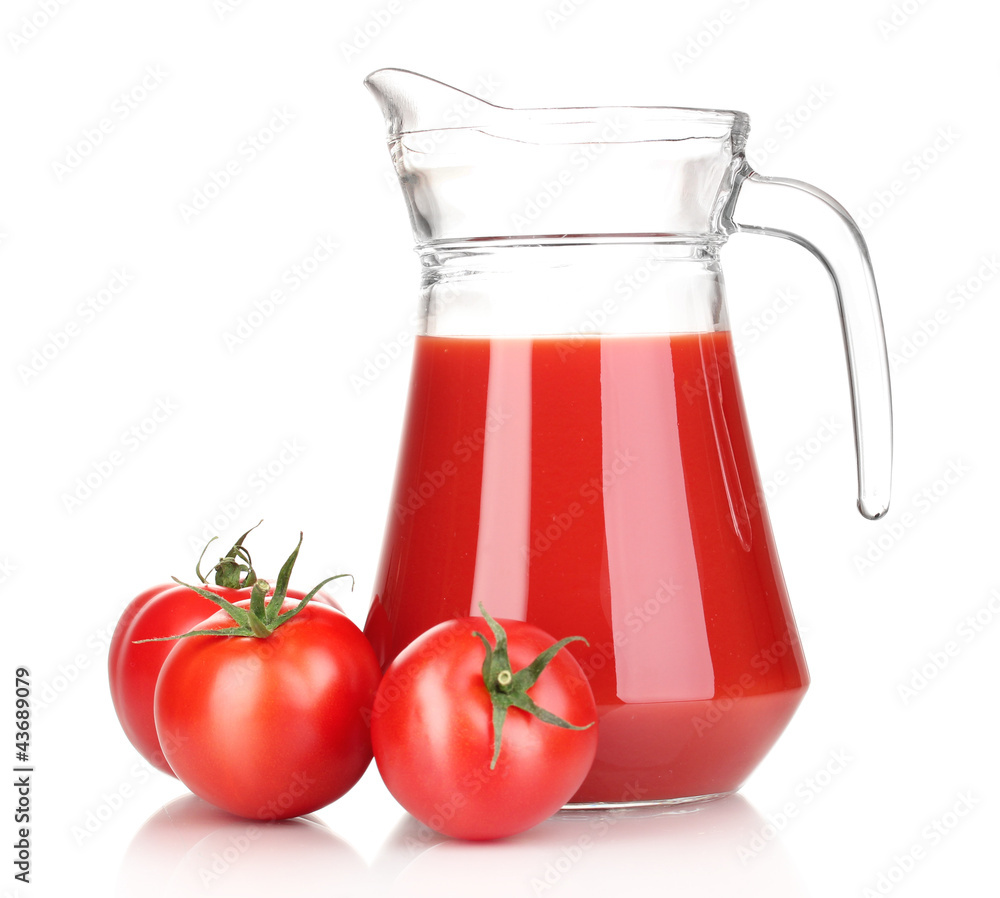 Tomato juice in pitcher isolated on white