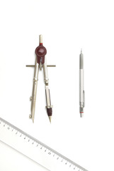 Aluminum pencil, drawing compass and ruler on white background