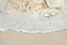 Wedding Rings On Rose Petal