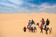 © chungking - camel caravan in desert