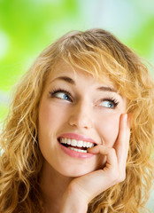 Wall Mural - Smiling young beautiful woman, indoors