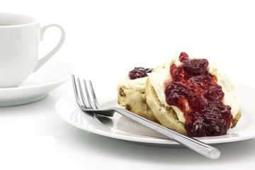 Home-baked scones with strawberry jam and clotted cream, often s