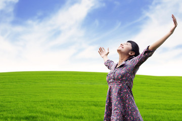 Carefree woman at the meadow