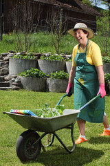 Happy senior working in her garden