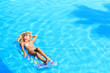 © Netfalls - Woman Relaxing in a pool