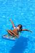 © Netfalls - Woman Relaxing in a pool